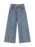 Pantalón vaquero largo de mujer con flecos y tiro alto