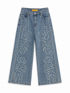 Pantalón vaquero largo de mujer con flecos y tiro alto